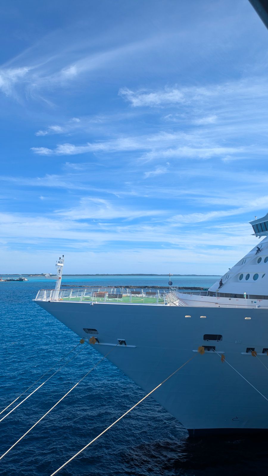 Cruise ship at sea under a clear blue sky
