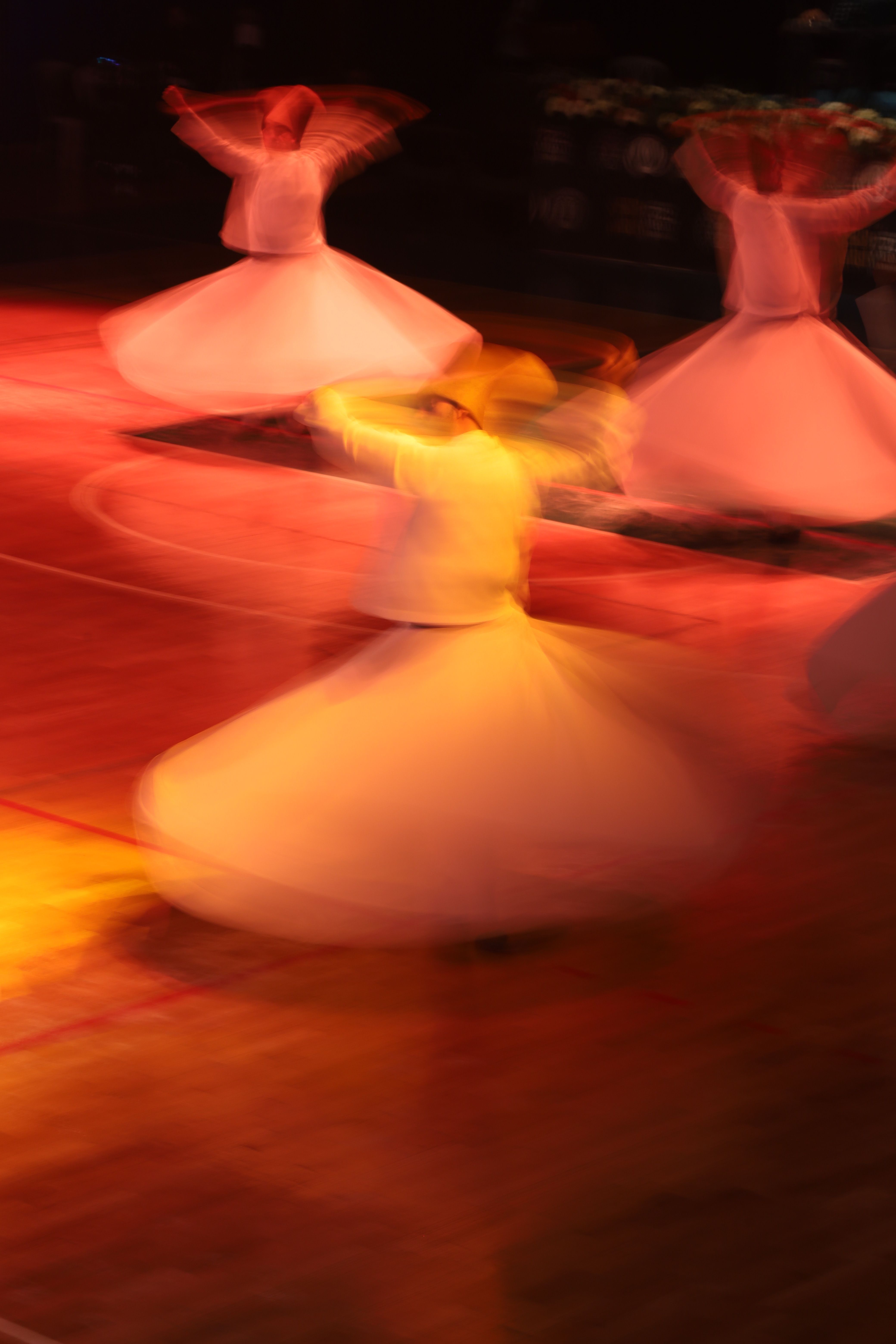 Dynamic whirling dervish performance in motion · Free Stock Photo