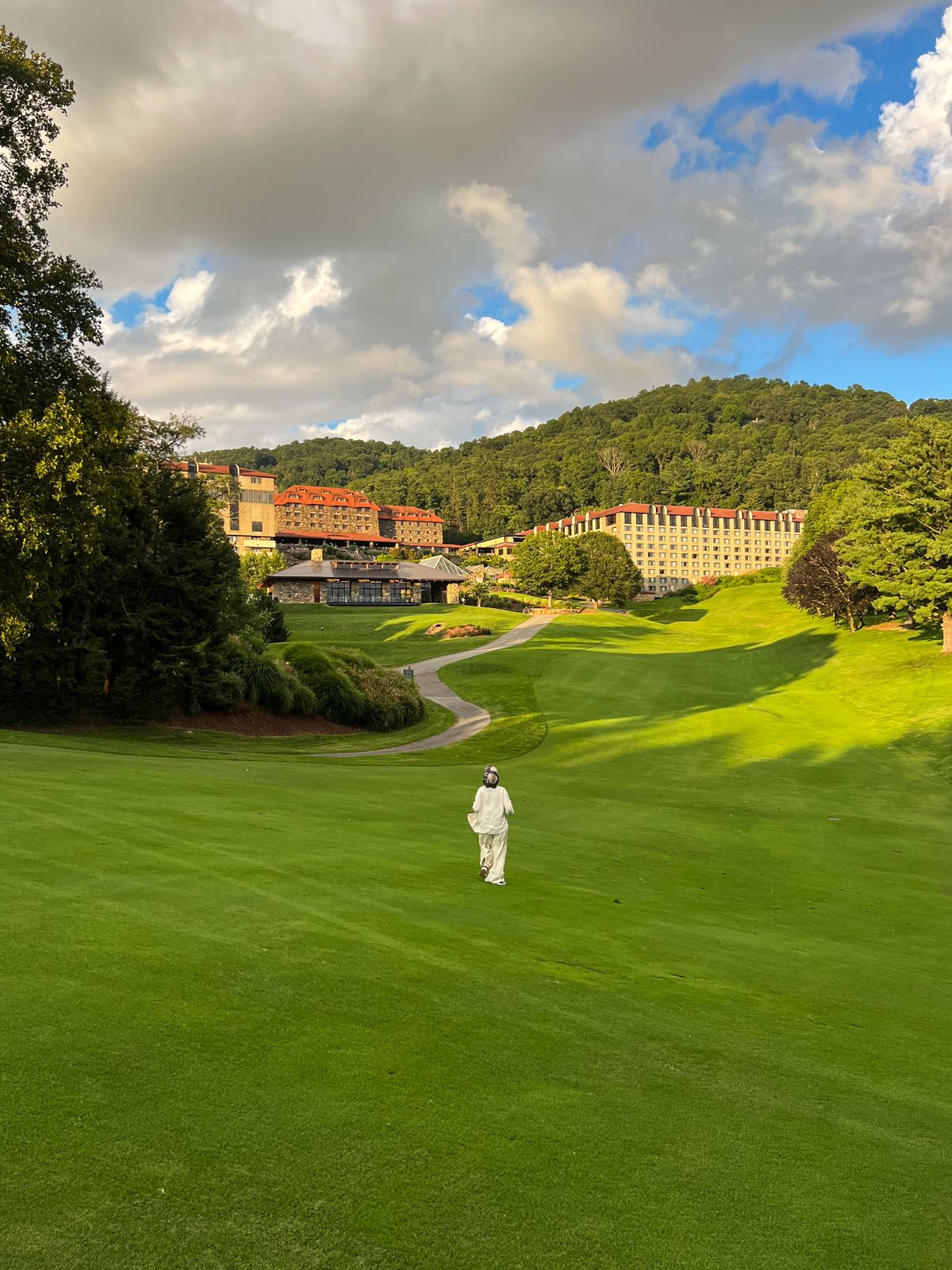Historic mountain retreat golf course and mountain backdrop