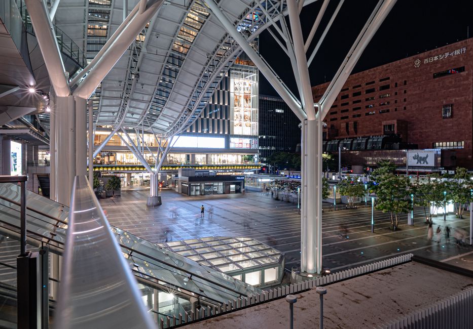 Explore the modern architectural marvel of Hakata Station in Fukuoka, Japan, captured at night.