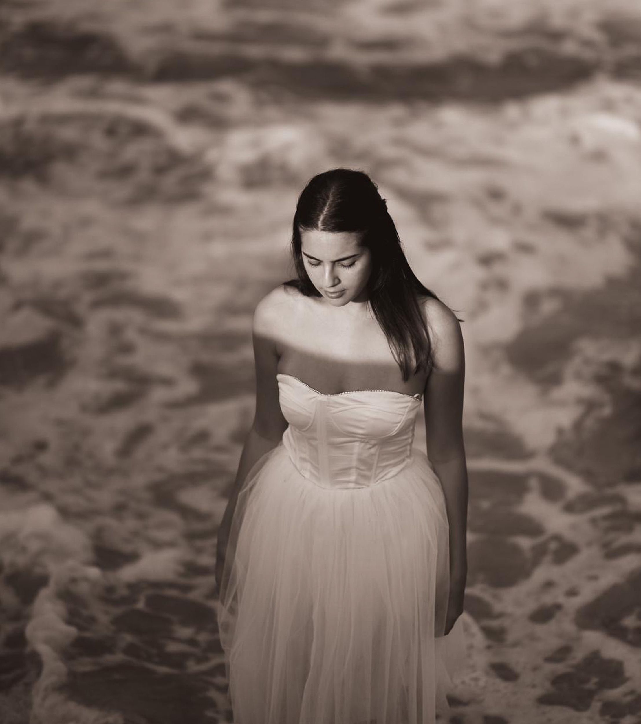 Elegant Woman in White Dress by Ocean Waves · Free Stock Photo