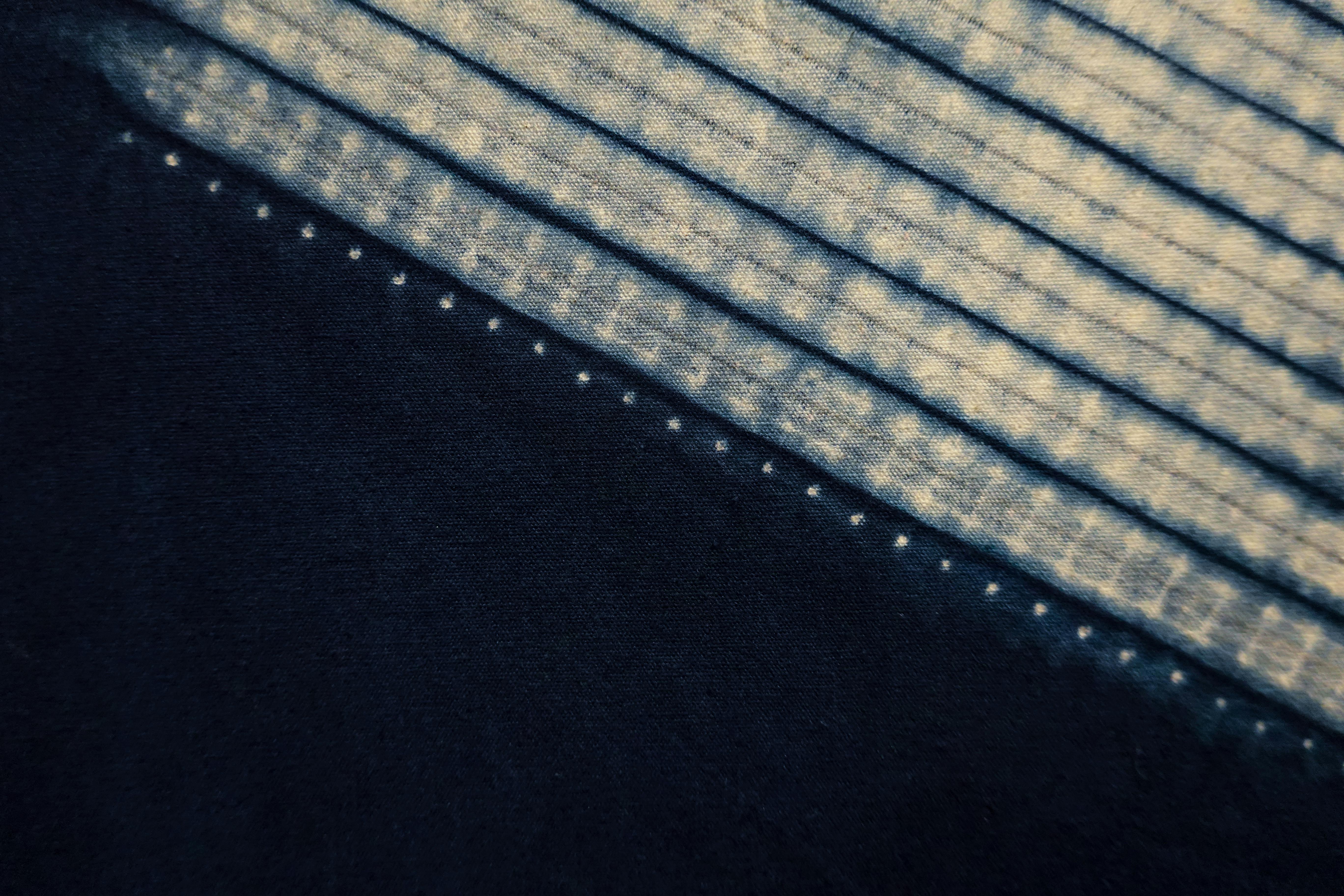Free Close-up of indigo-dyed fabric showcasing unique geometric patterns and textures. Stock Photo