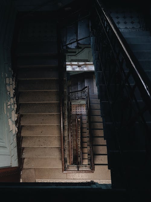 Black Metal Staircase on Brown Concrete Staircase