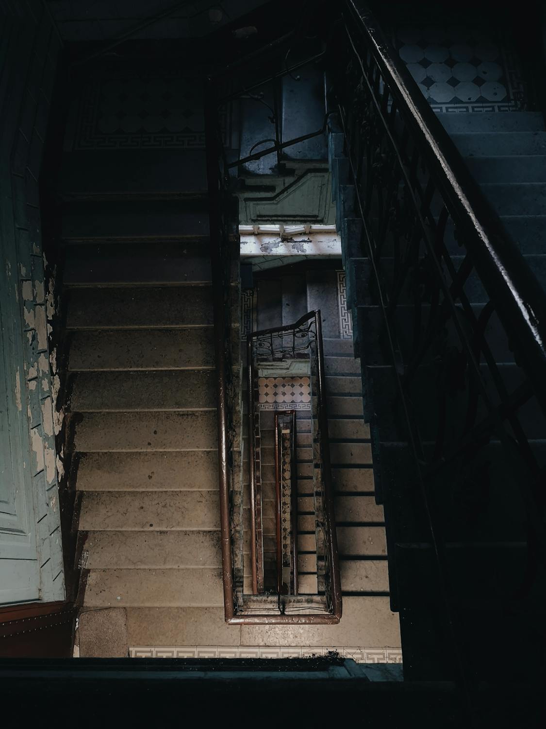 Black Metal Staircase on Brown Concrete Staircase · Free Stock Photo