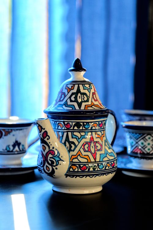 Free Artistic Moroccan teapot with intricate geometric patterns, perfect for cultural or travel themes. Stock Photo