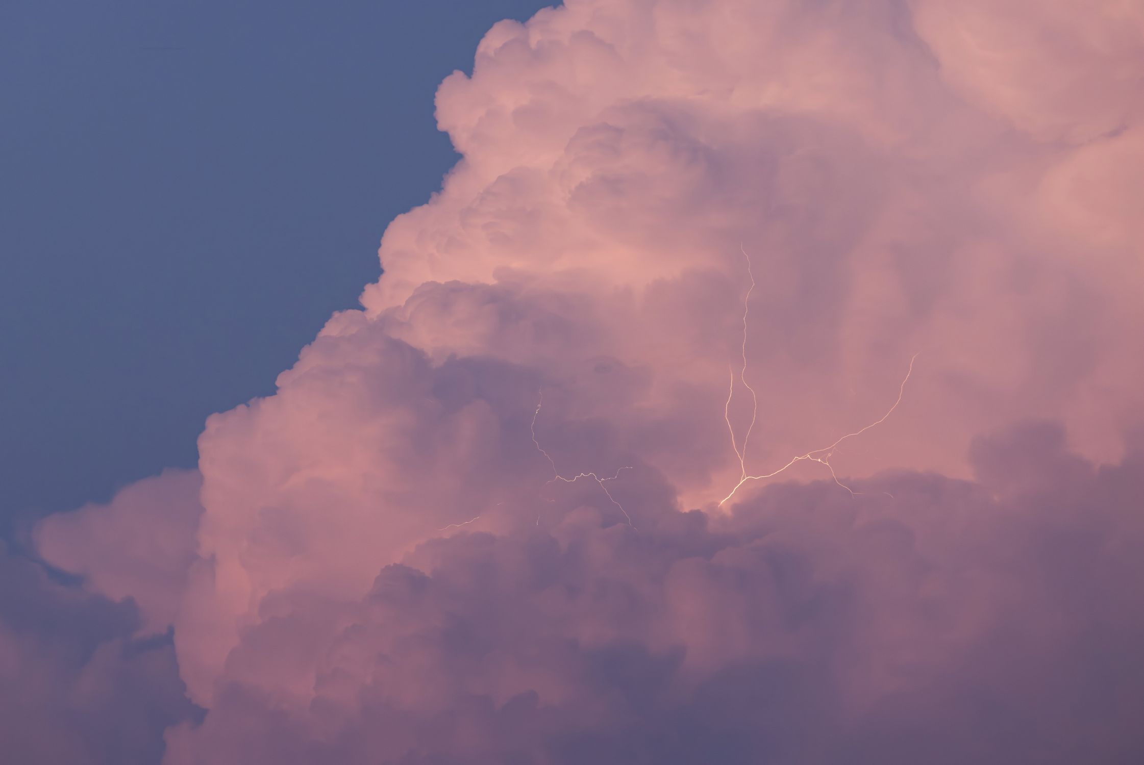 Dramatic Pink Thunderstorm Clouds with Lightning · Free Stock Photo