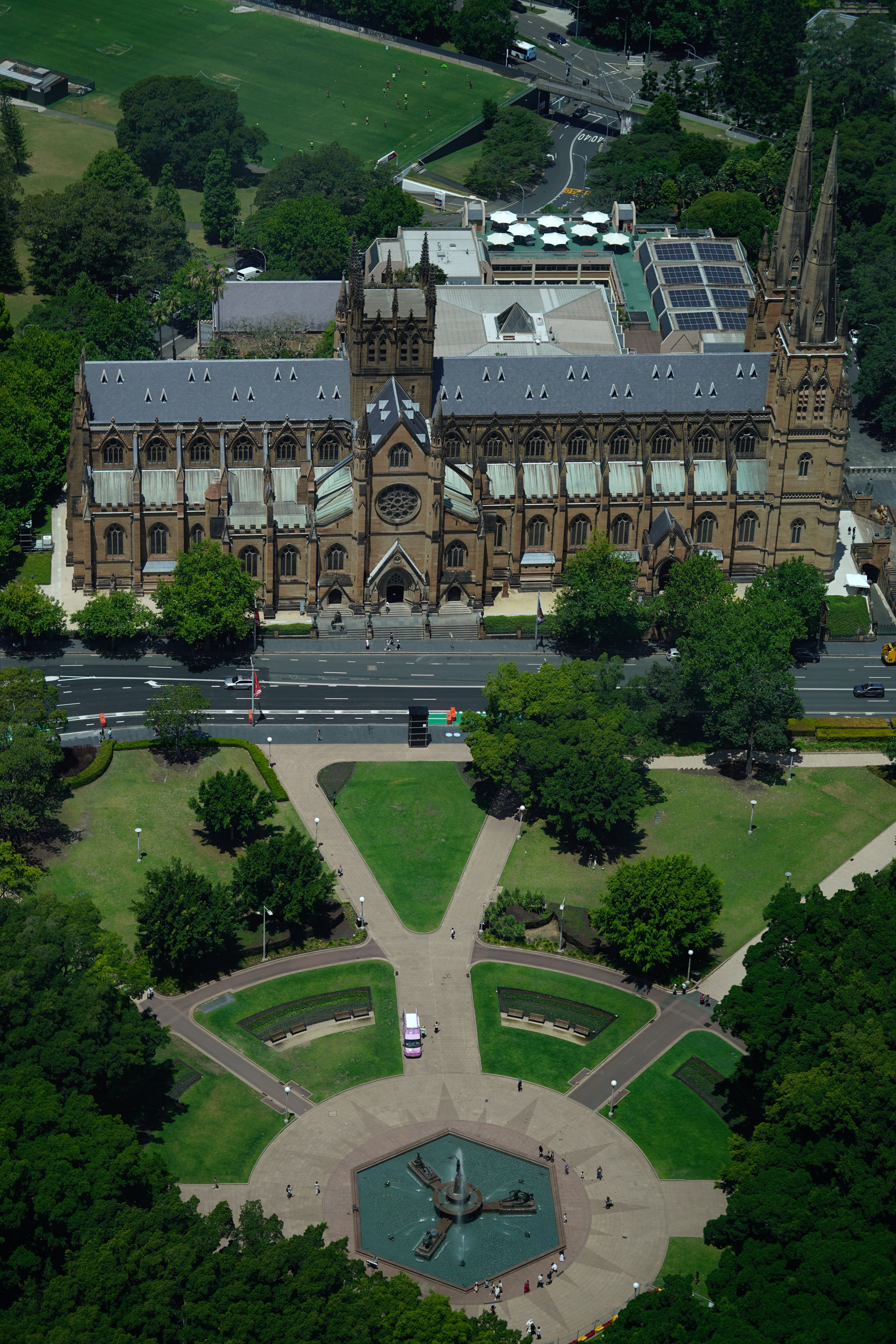 Aerial view of St. Mary's Cathedral in Sydney surrounded by lush greenery.