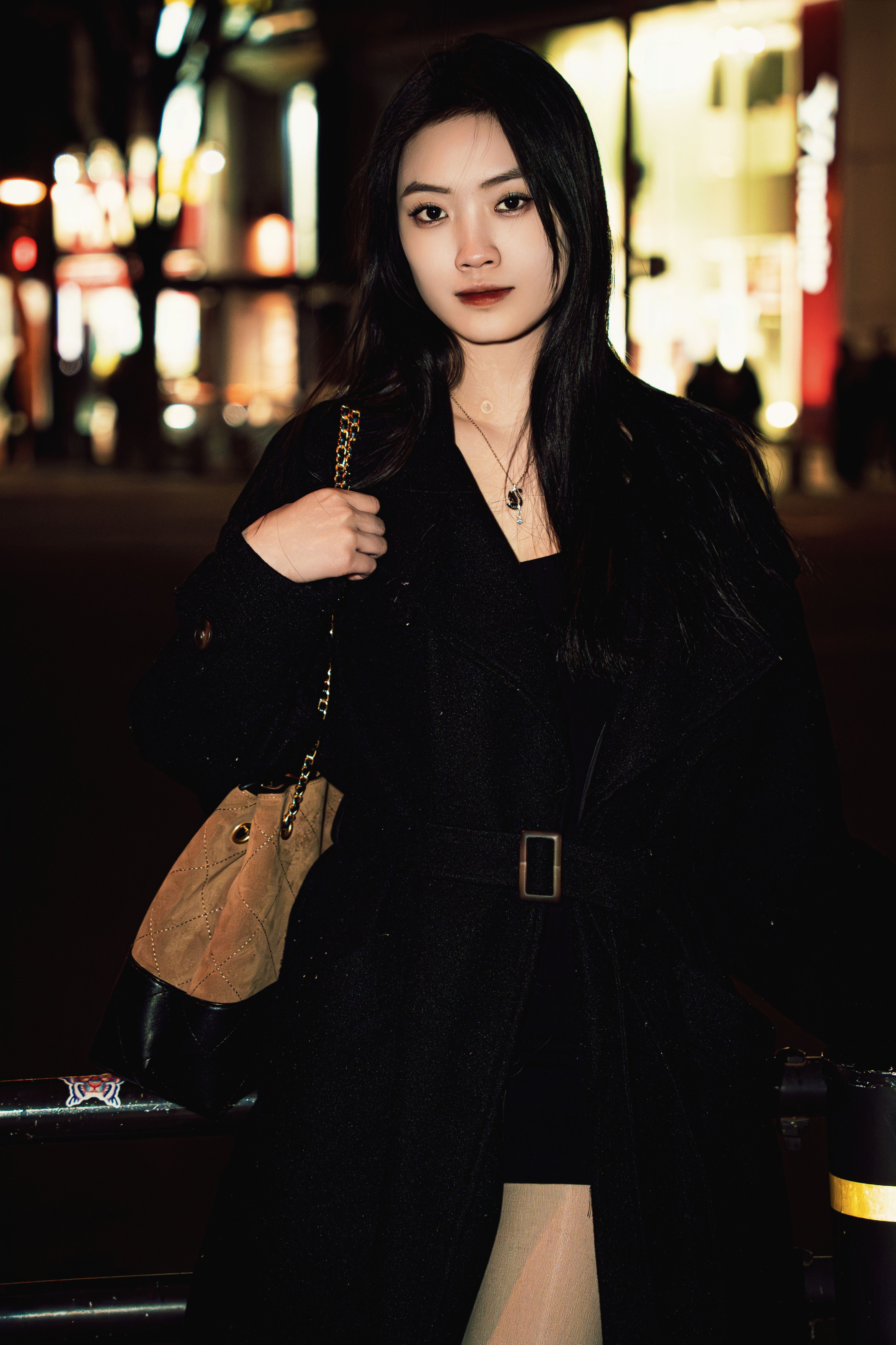 Elegant Woman Posing at Night in Urban Setting · Free Stock Photo