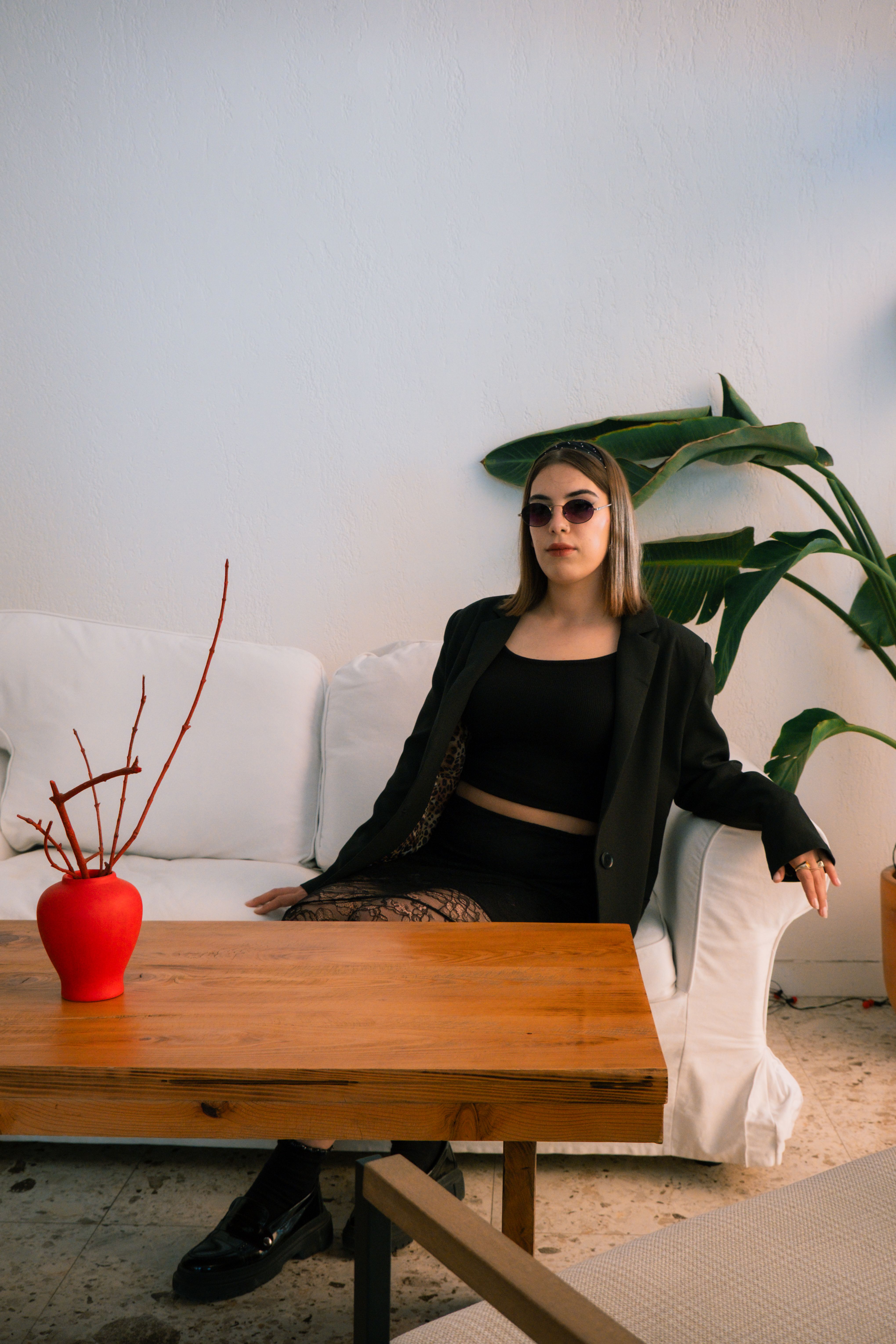 Stylish Woman Posing Indoors with Modern Decor · Free Stock Photo