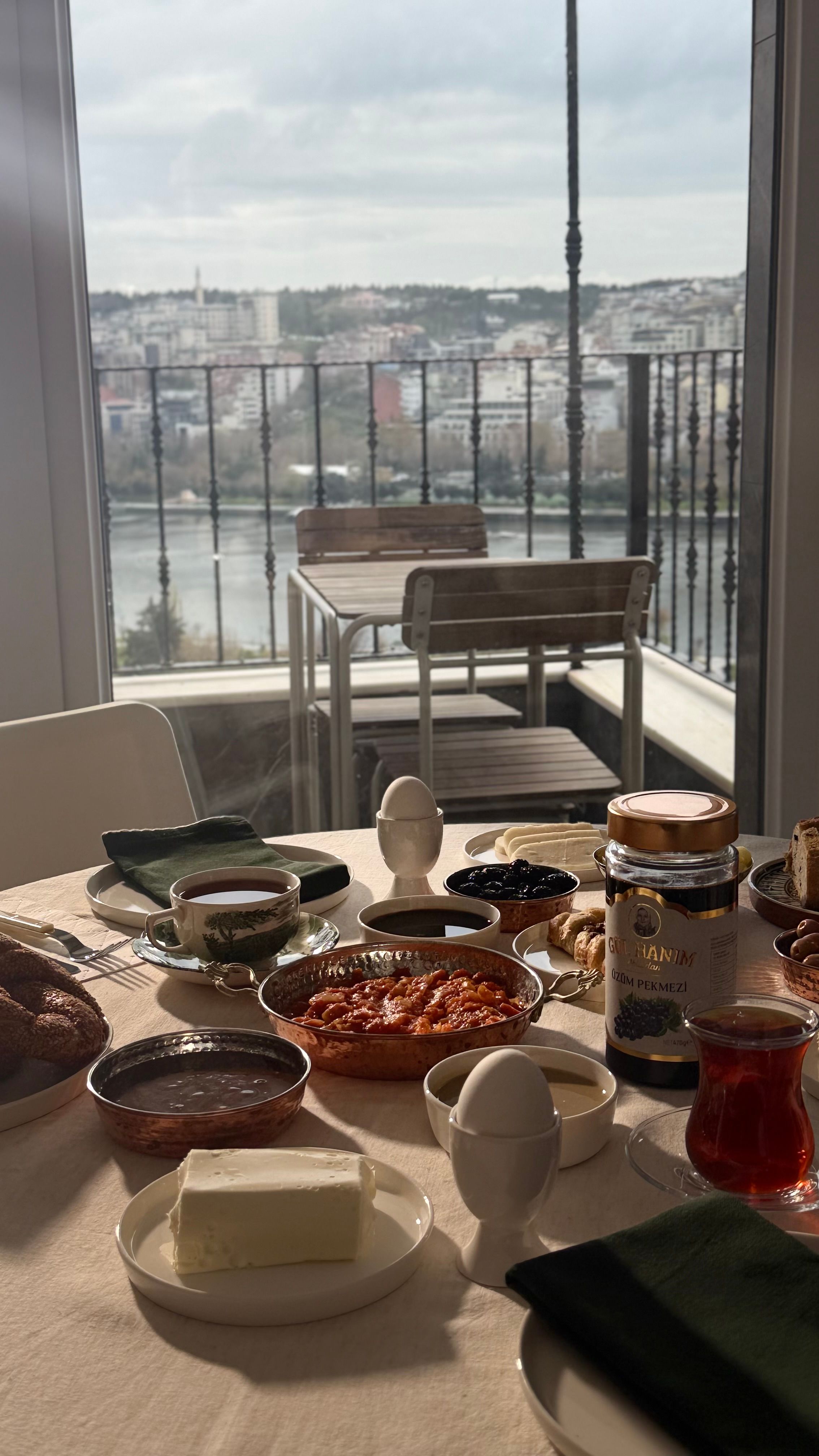 A delightful breakfast spread with a cityscape view, perfect for a relaxing morning.