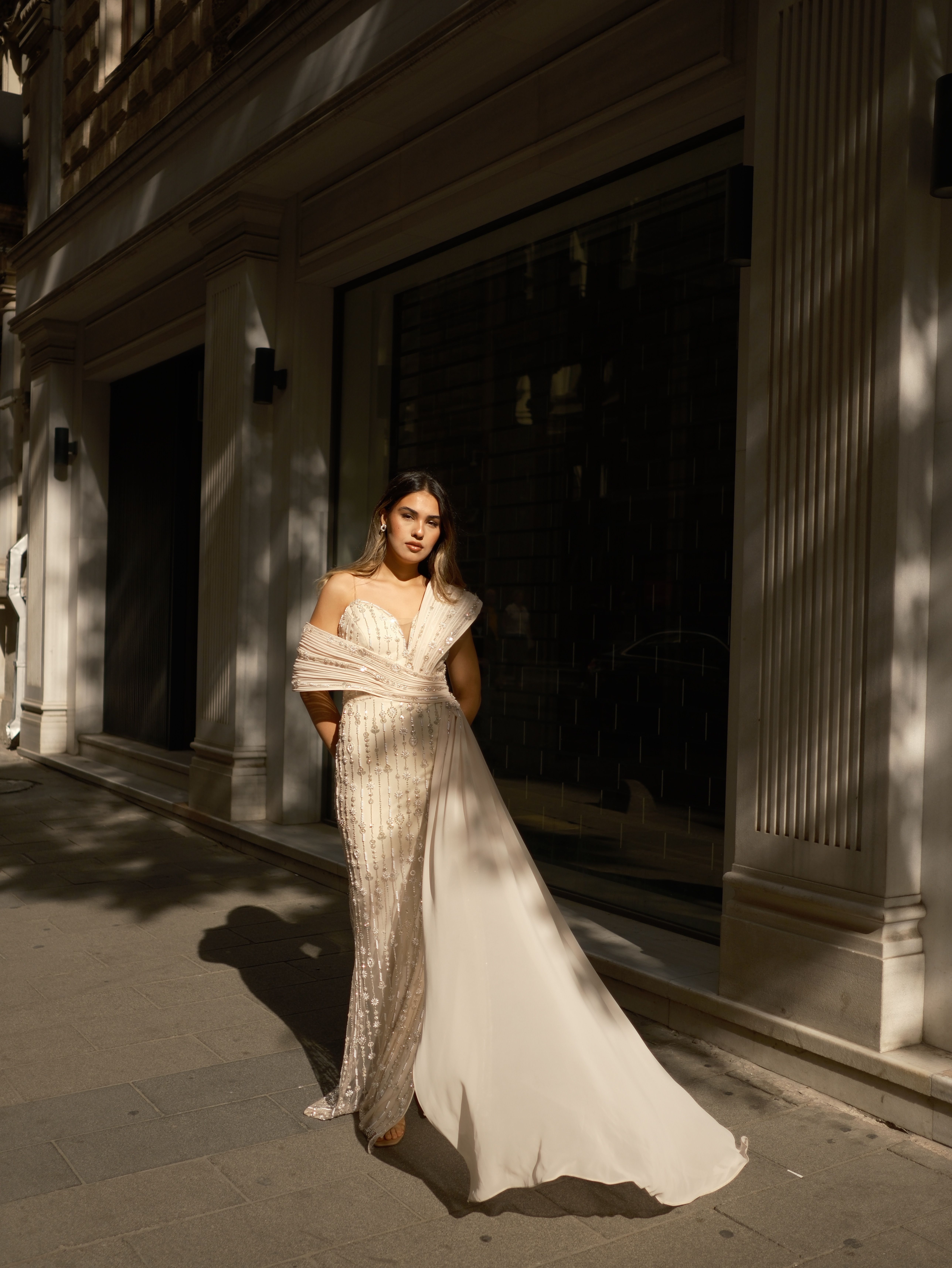 Elegant Woman in Evening Gown on City Street