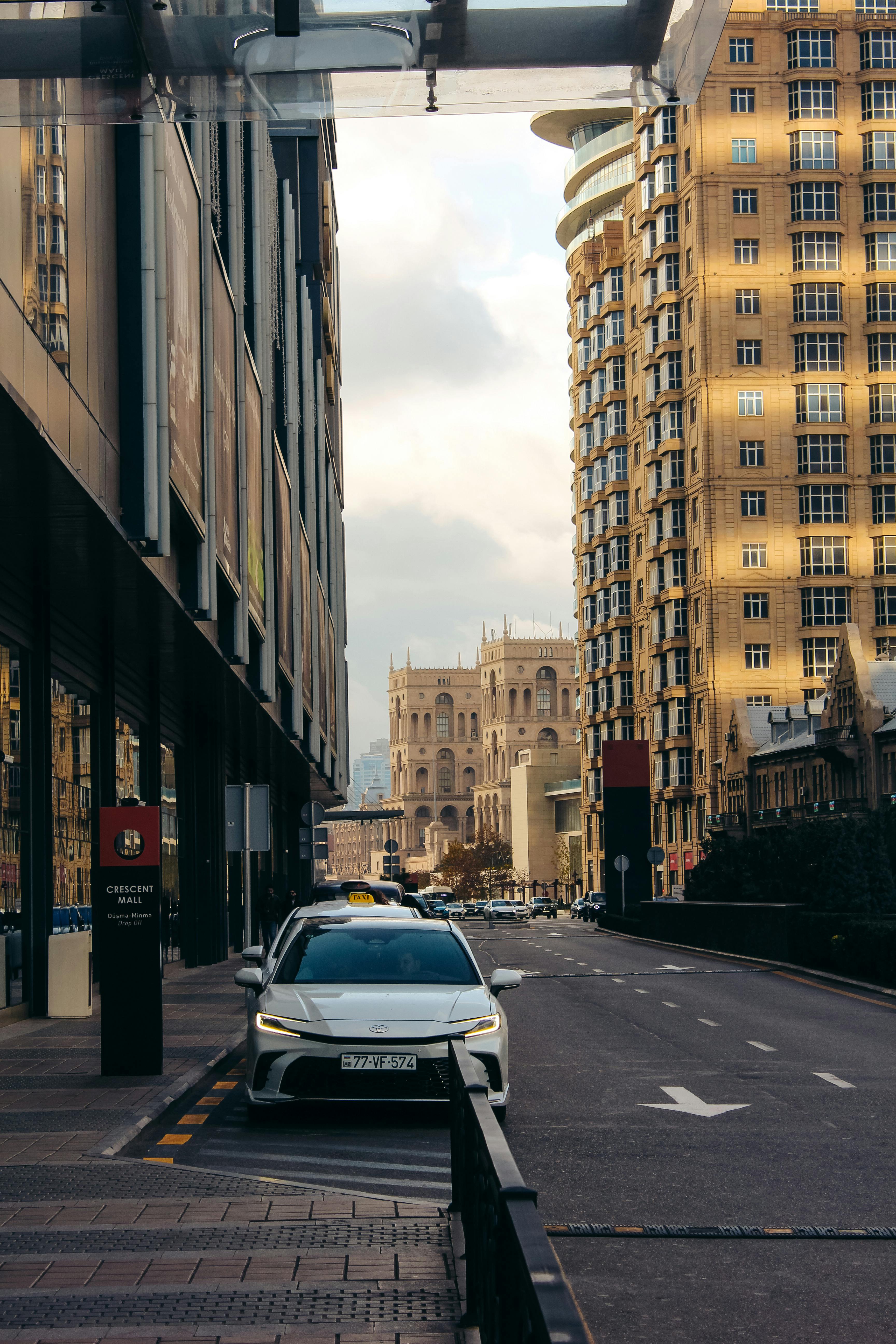 A bustling city street with modern skyscrapers and classic architecture.