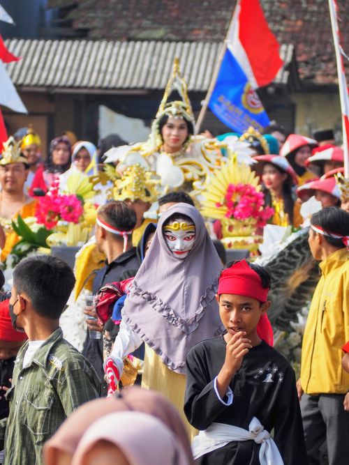 Free Vibrant parade featuring traditional costumes and masks in West Java, Indonesia. Stock Photo