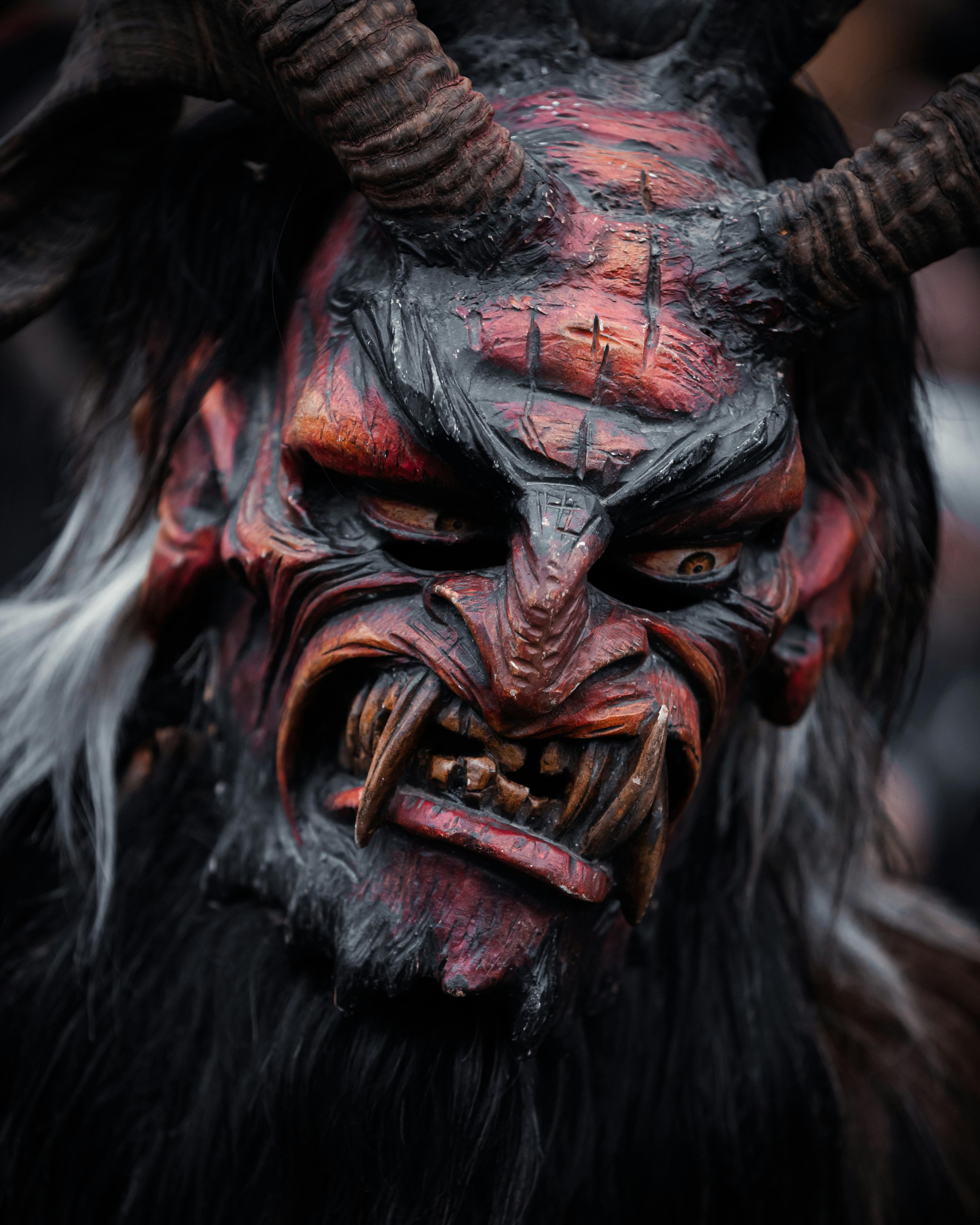 Detailed close-up of a traditional Krampus mask showcasing its artistry and cultural significance.