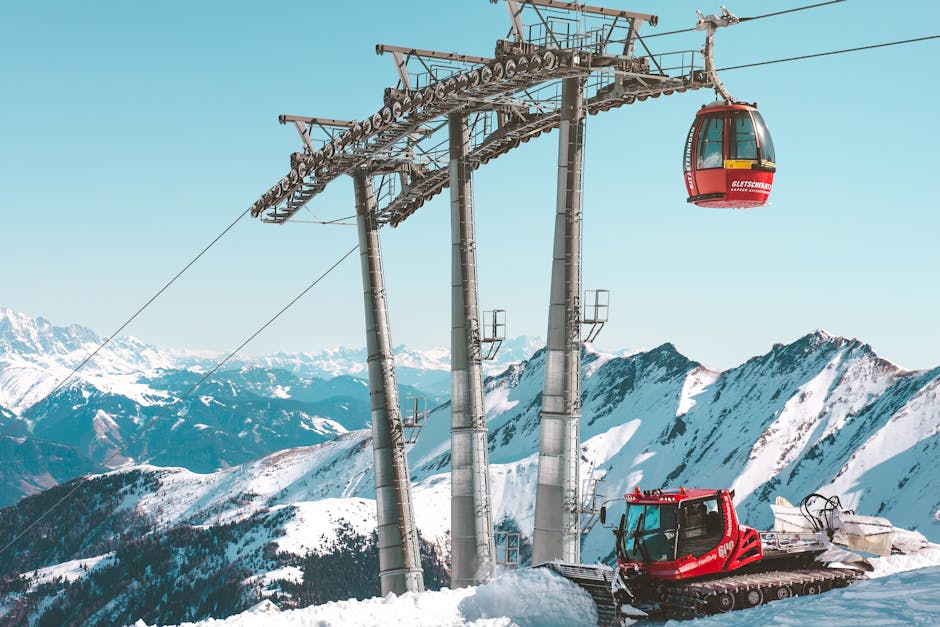 Scenic view of a ski resort cable car and snowplow in Zell am See, Austria.