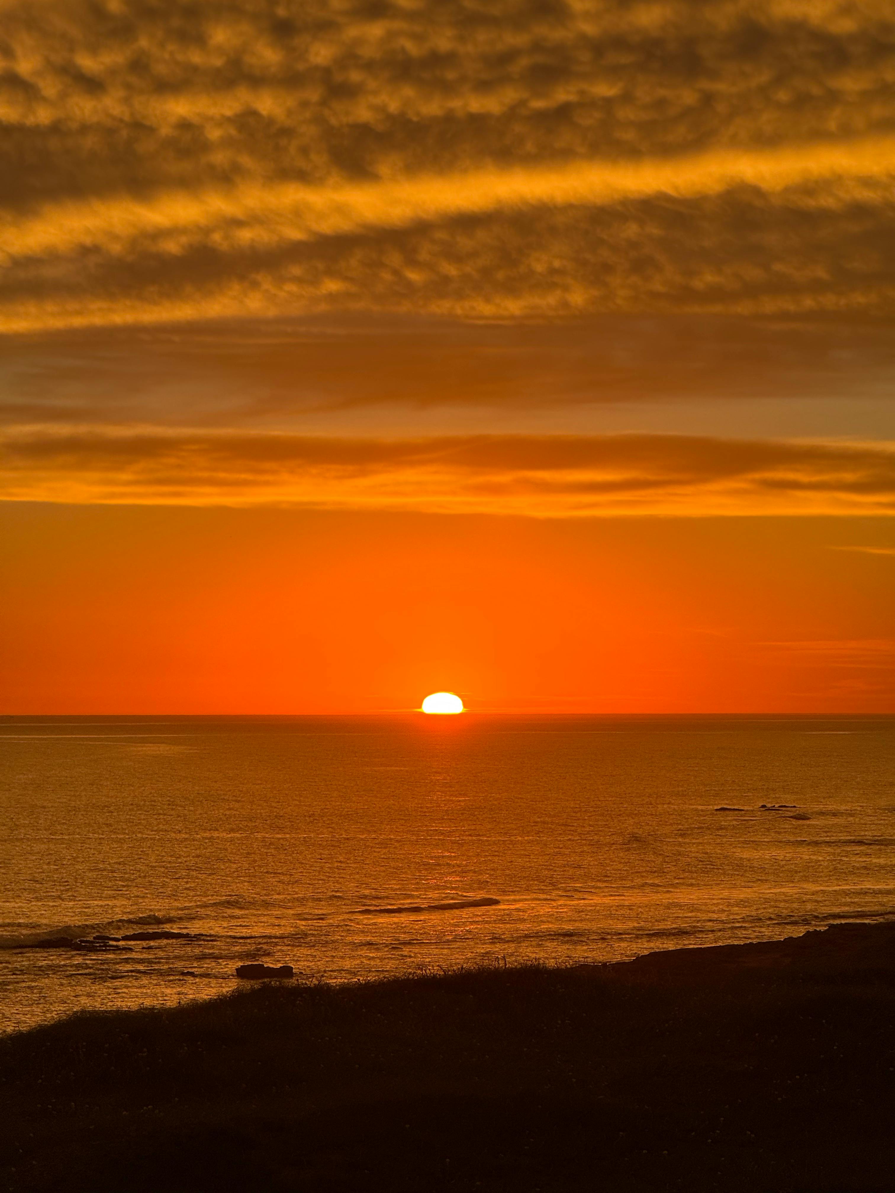 Vibrant sunset over the Atlantic Ocean viewed from Necochea, Argentina.