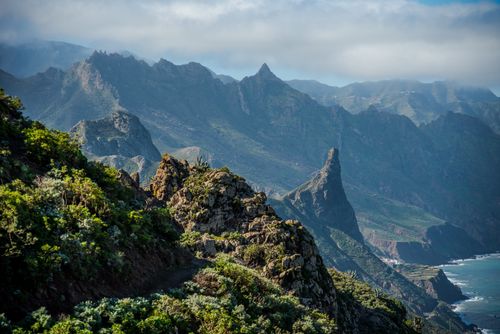 Free Explore the rugged beauty of the Tenerife coastline in Spain's Canary Islands, showcasing dramatic cliffs and lush landscapes. Stock Photo