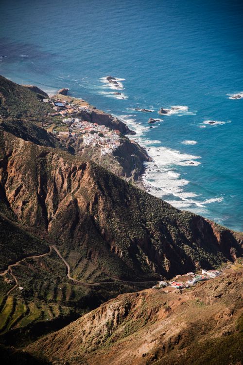 Free A breathtaking aerial view of Tenerife's rugged cliffs and ocean, showcasing natural beauty. Stock Photo