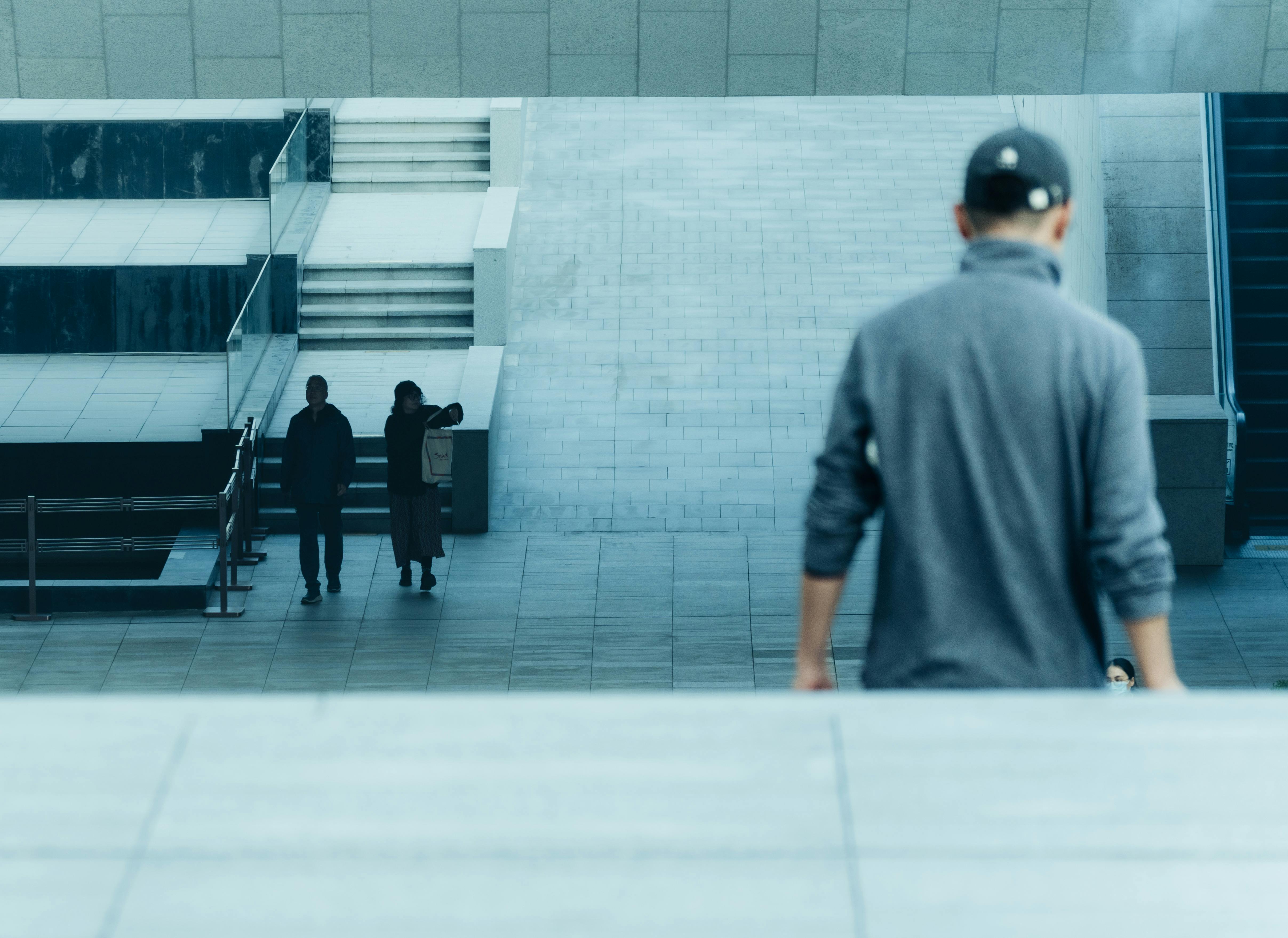 Modern architectural space with diverse people in an urban setting.