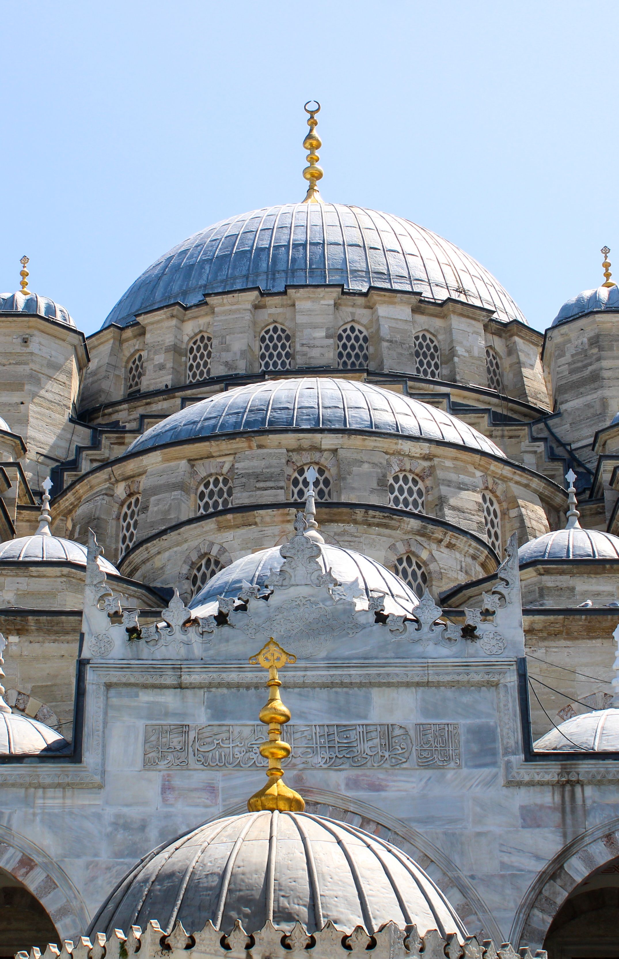 Close-up of the Sultan Ahmed Mosque's intricately designed domes in Istanbul, Türkiye.