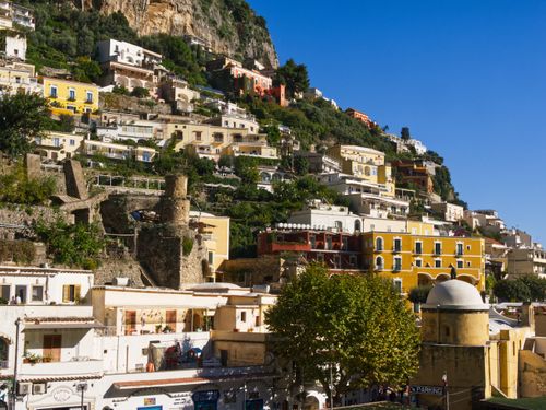 Free Colorful hillside buildings in Positano, Italy under a clear blue sky. Stock Photo