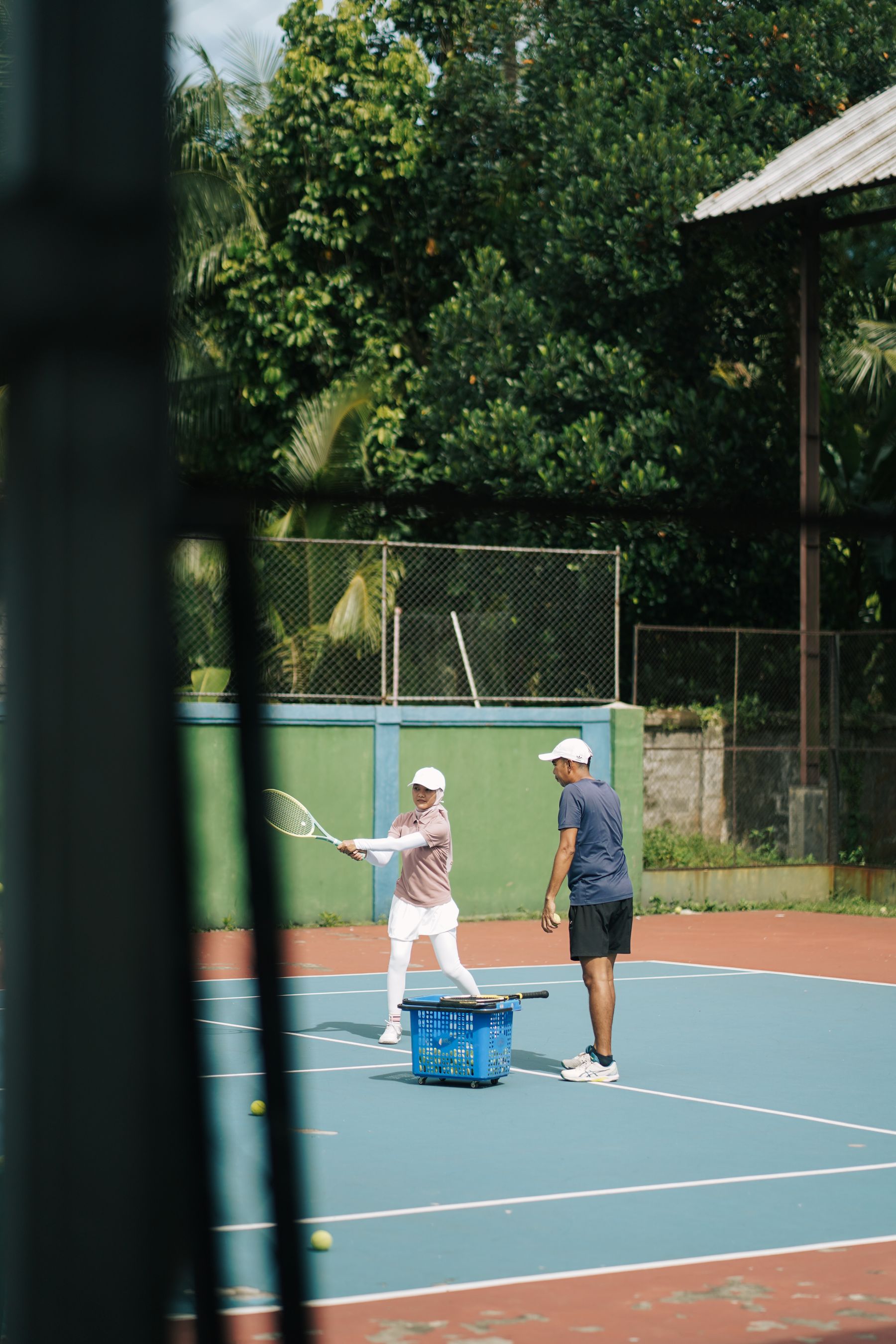 Tennis scene illustrating Meet Coach Maya Chen.