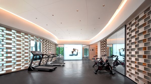 Gym with a large wall-mounted screen