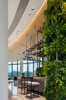 Modern indoor setting with a vertical garden and contemporary design elements.