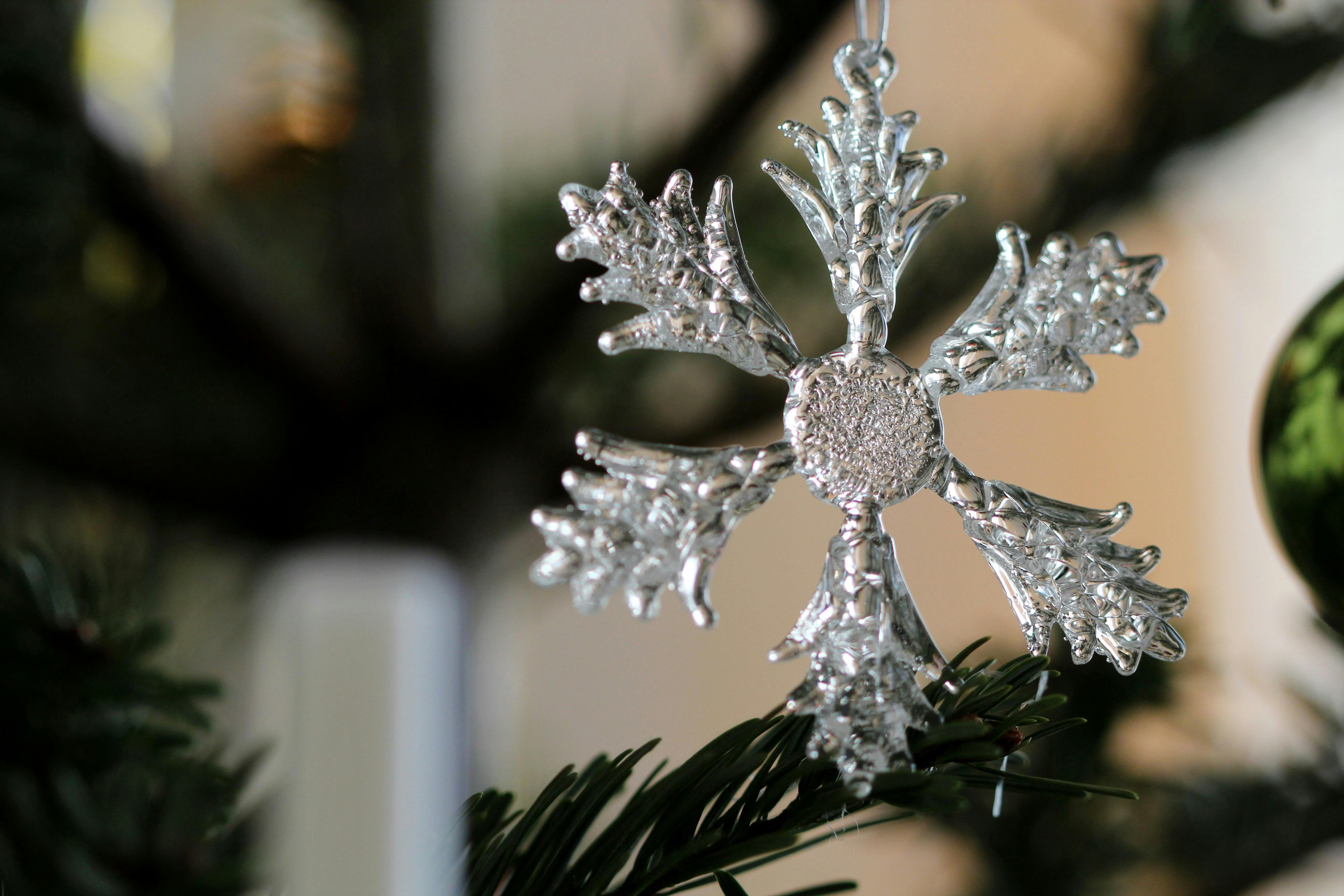 Elegant silver snowflake ornament on a Christmas tree in Vienna, Austria.