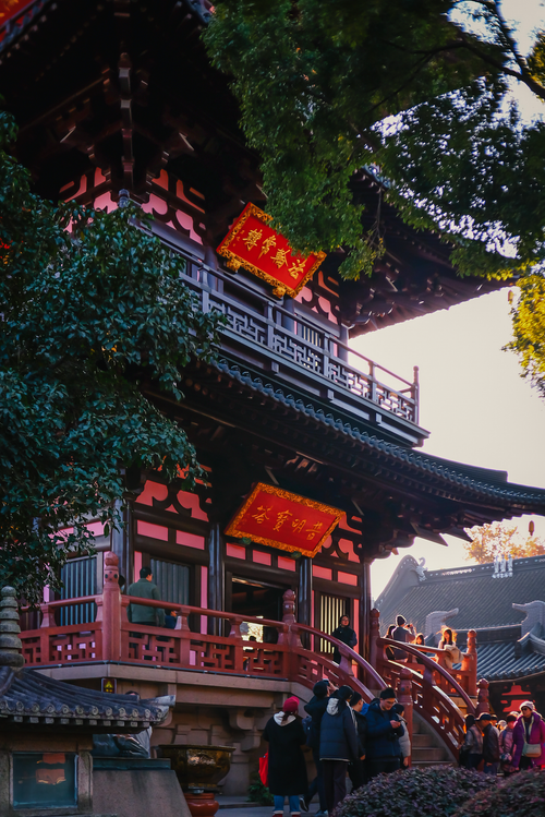 Free A vibrant Chinese temple surrounded by tourists on a sunny day. Stock Photo