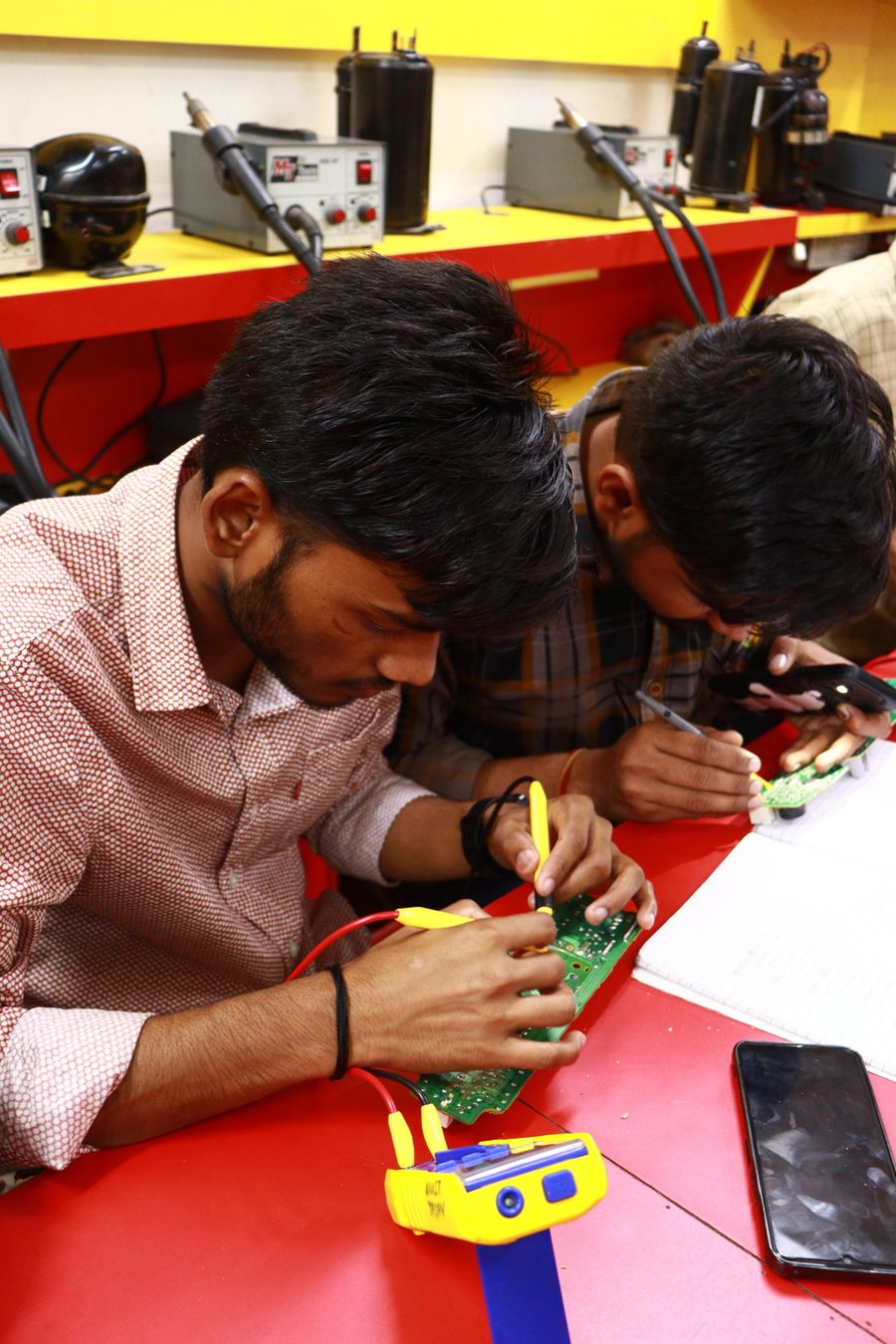 Students in an electronics workshop