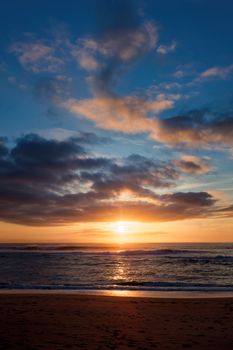 Captivating sunset view over the ocean from Étel Beach in Brittany, France.