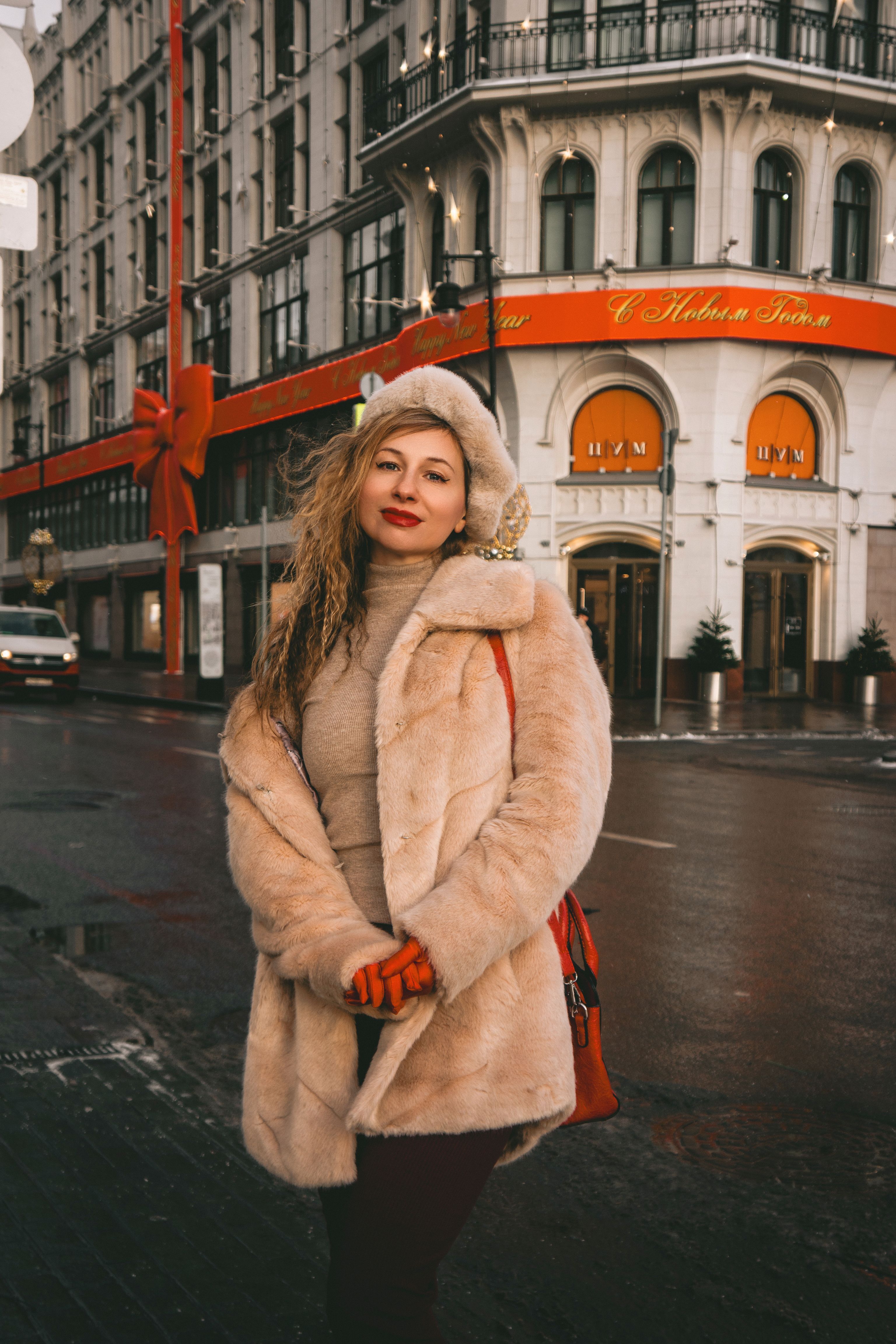 Fashionable Woman in Fur Coat on City Street · Free Stock Photo