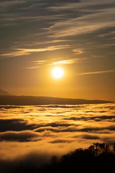 Stunning golden sunset over a sea of clouds in Lausanne, Switzerland.