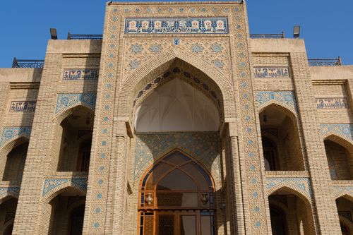 Free Detailed view of traditional Uzbek architecture showcasing intricate tile work and calligraphy in Uzbekistan. Stock Photo