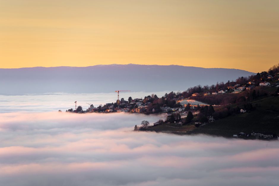 Majestic sunset over Lausanne with a sea of clouds blanketing the valley.