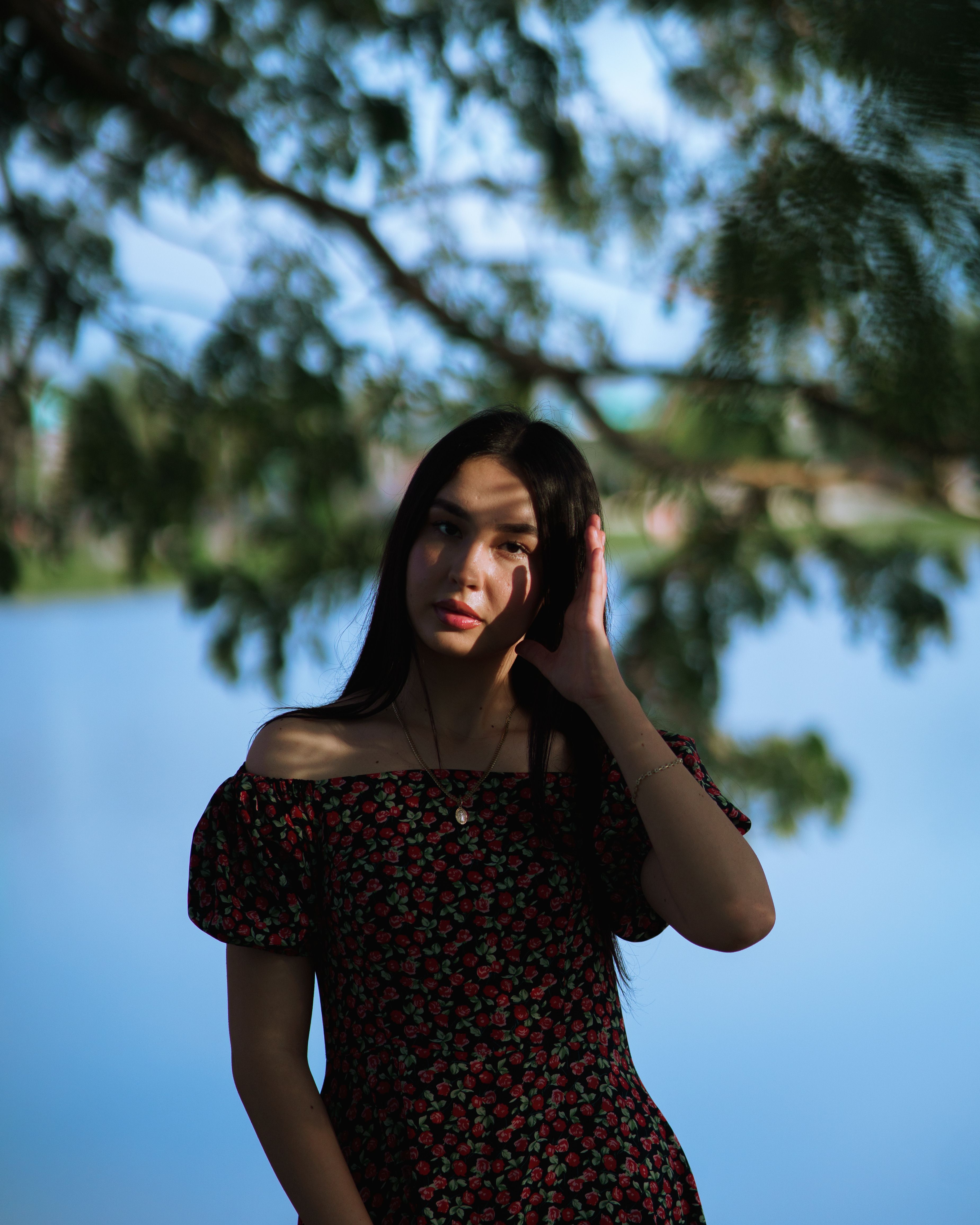 Young Woman in Floral Dress by Lakeside · Free Stock Photo