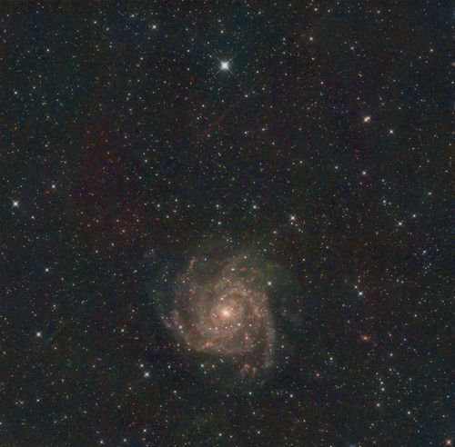 Free Mesmerizing view of spiral galaxy surrounded by stars in deep space, highlighting the universe's grandeur. Stock Photo