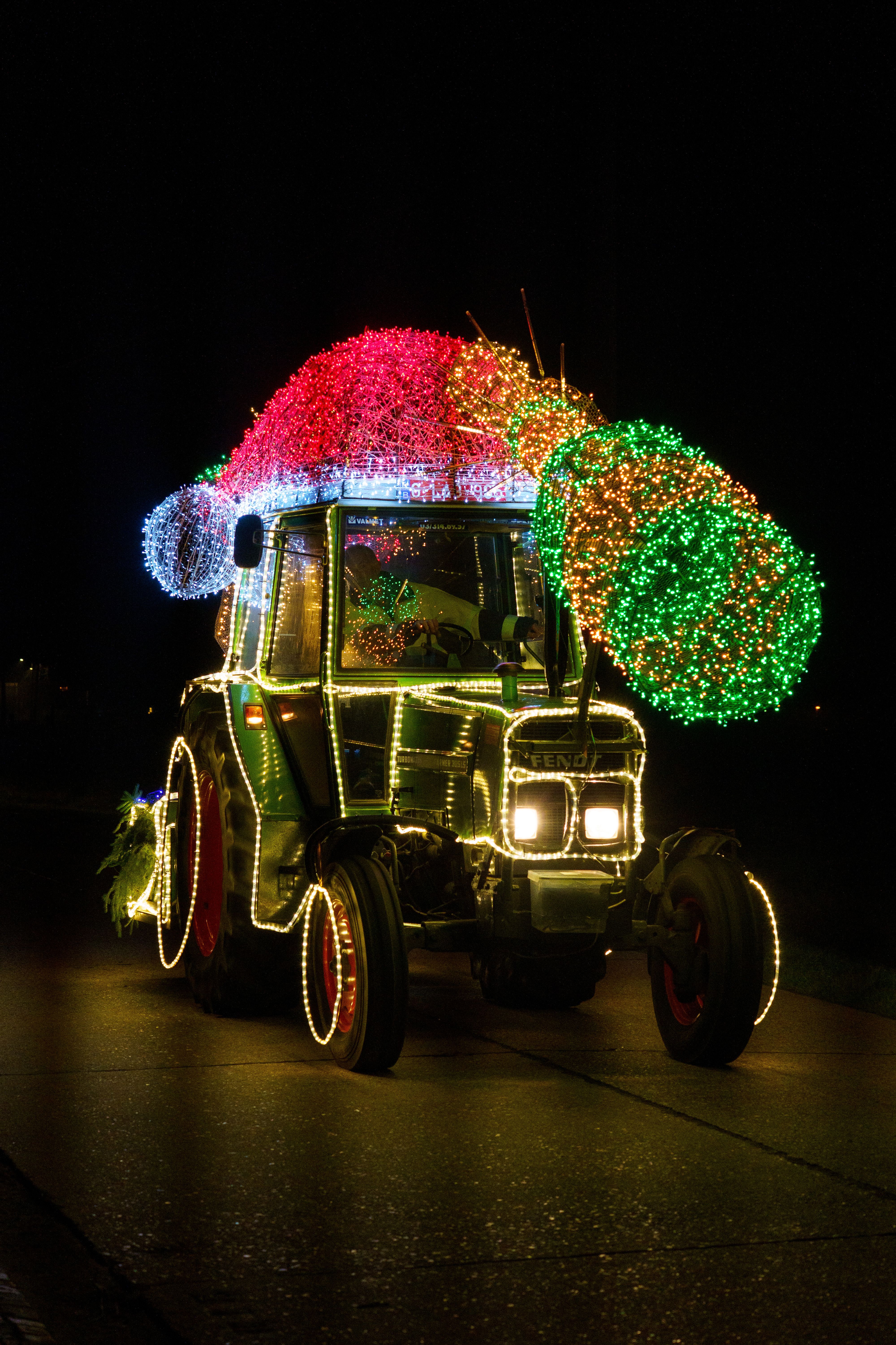 Festive Tractor Decorated with Colorful Lights · Free Stock Photo