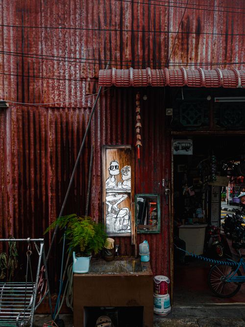 Free Explore the captivating street art on a rustic tin wall in George Town, Penang, Malaysia. Stock Photo