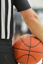 Basketball Referee Holding Game Ball