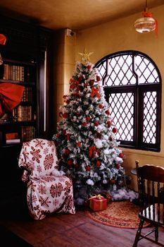 A beautifully decorated Christmas tree in a cozy living room setting, perfect for the holiday season.