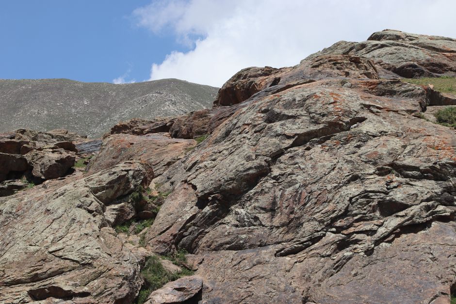 Majestic rocky mountain landscape under a clear blue sky offers an adventurous backdrop for nature enthusiasts.