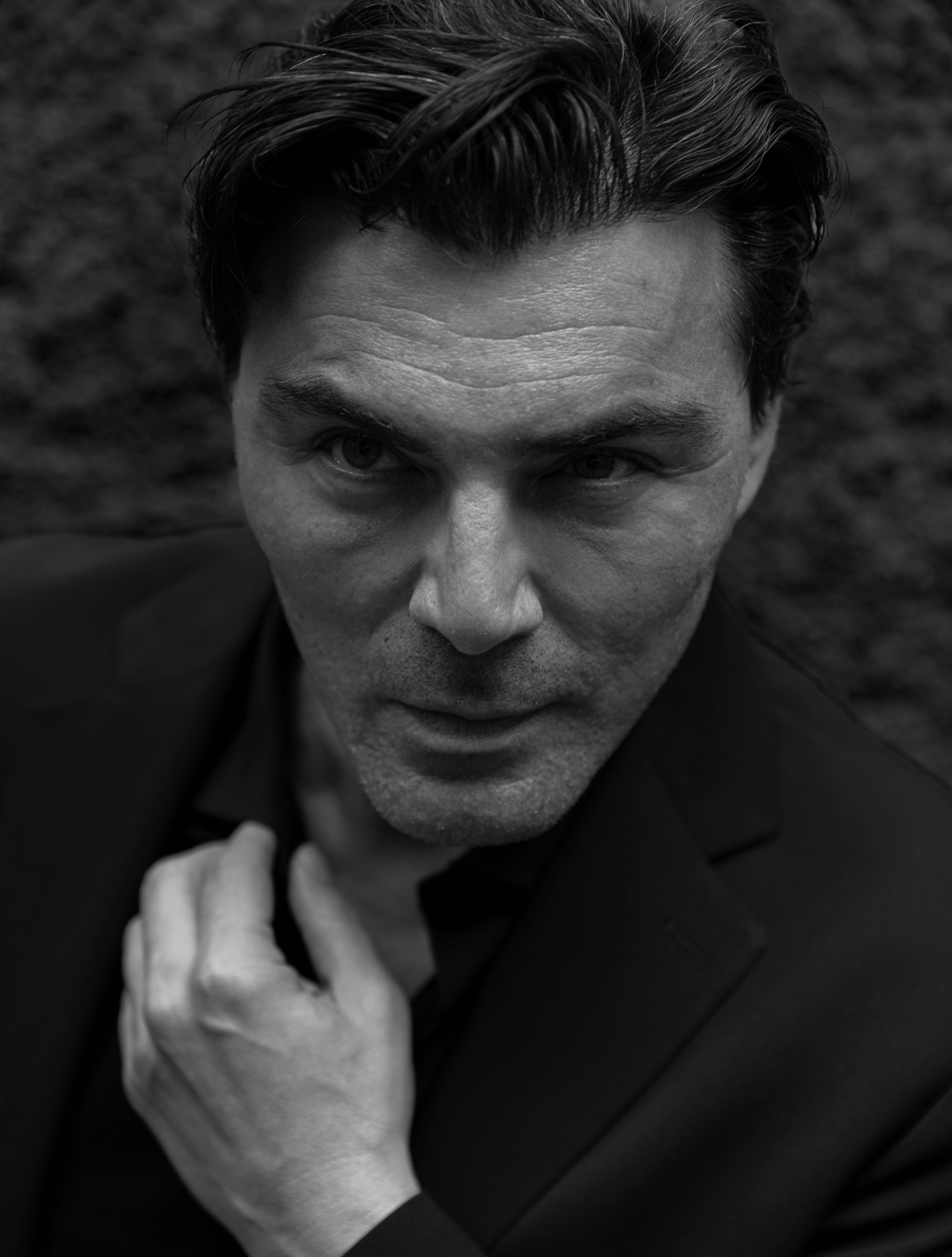 Black and white portrait of a man in Marrakesh with an intense, thoughtful expression.