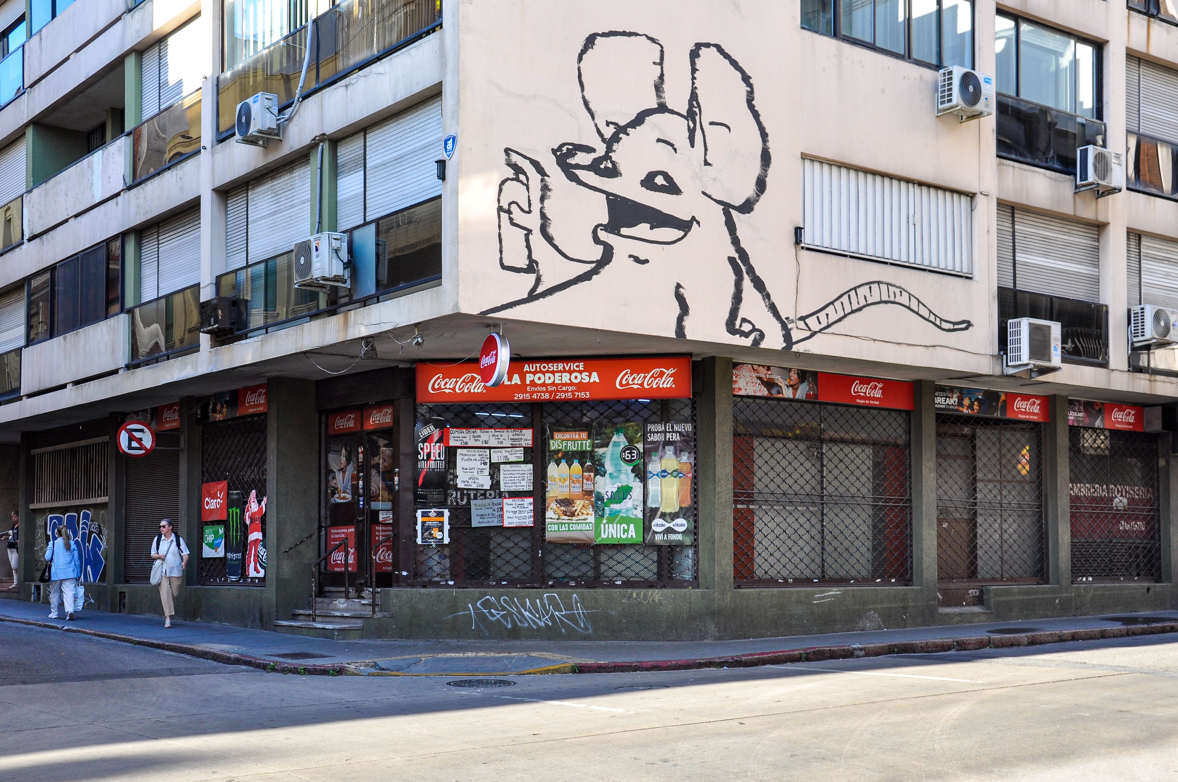 Colorful street art on a building in Montevideo, Uruguay captures urban lifestyle and creativity.