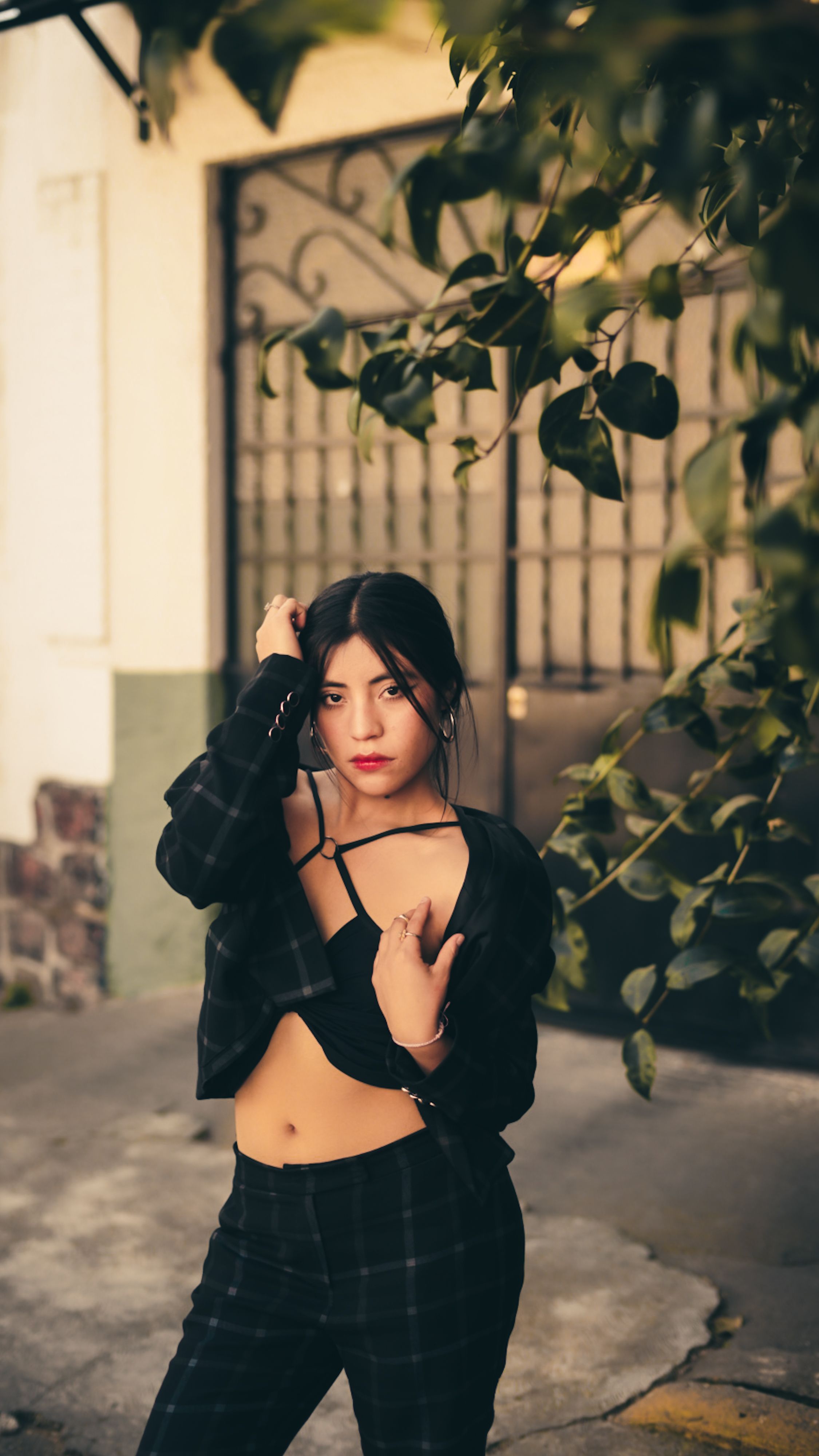 Stylish Woman Posing Outdoors in Urban Setting · Free Stock Photo