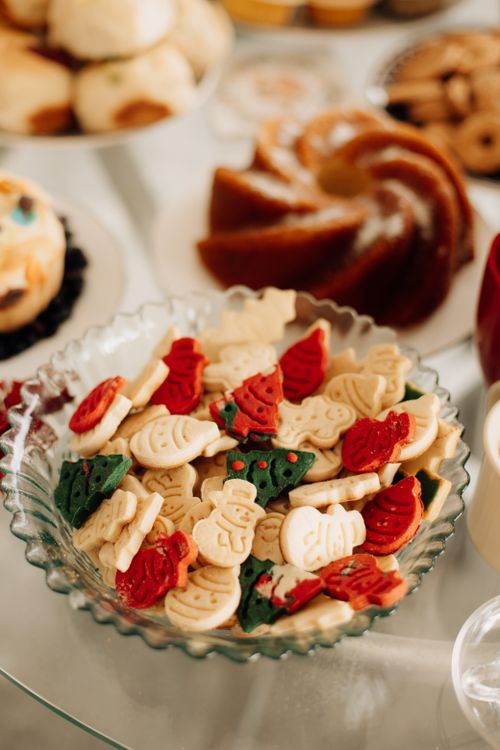 Free Colorful festive cookies in a bowl, perfect for holiday celebrations and dessert tables. Stock Photo