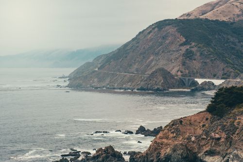 Free Stunning view of Big Sur coastline with rugged cliffs and Pacific Ocean waves. Stock Photo