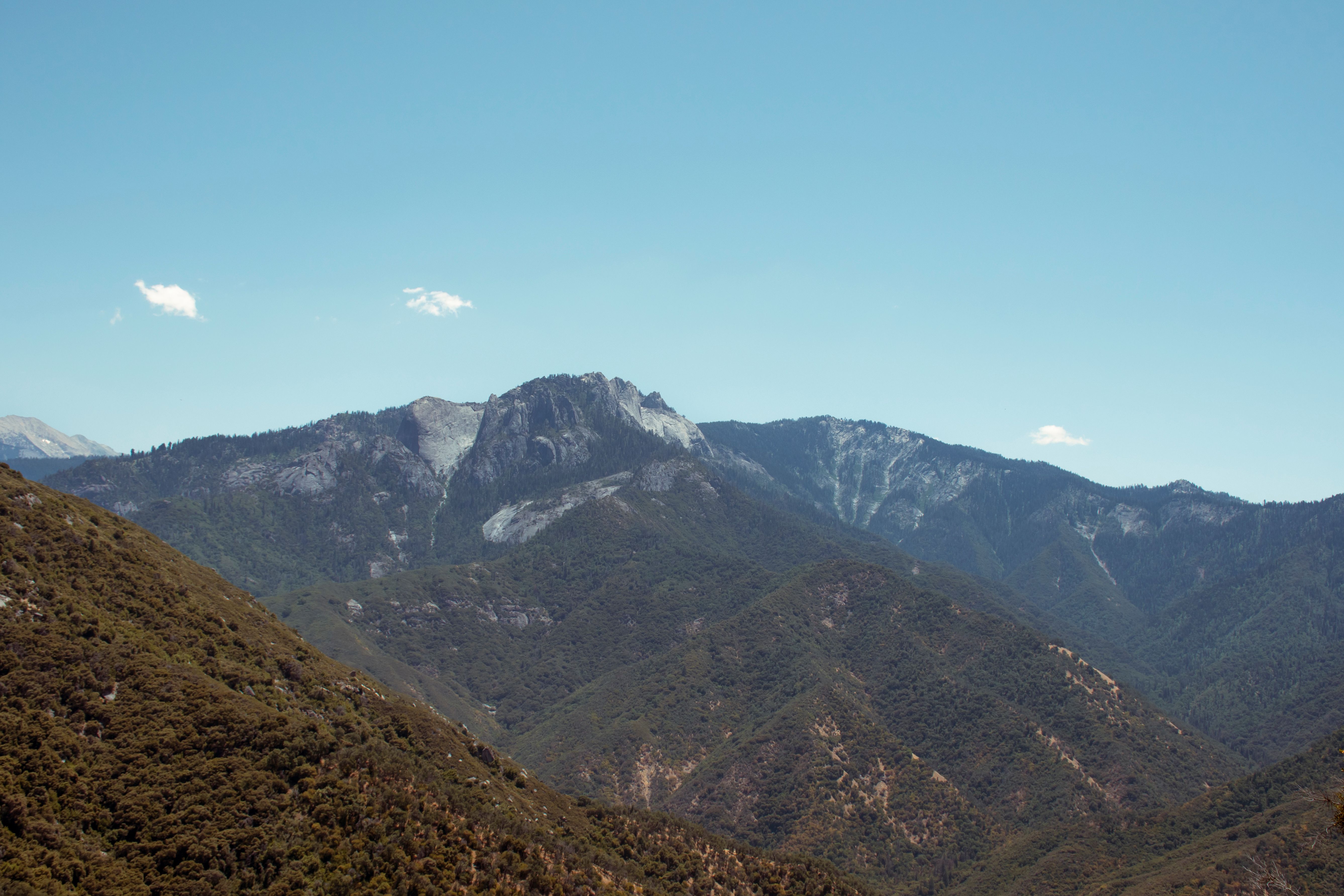 Scenic View of Mountain Range under Clear Blue Sky · Free Stock Photo