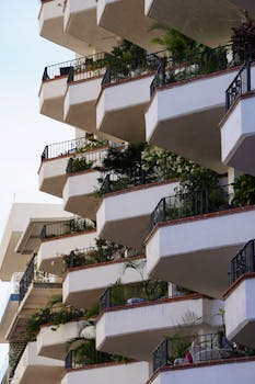 A series of charming balconies adorned with lush greenery in Puerto Vallarta, Mexico.